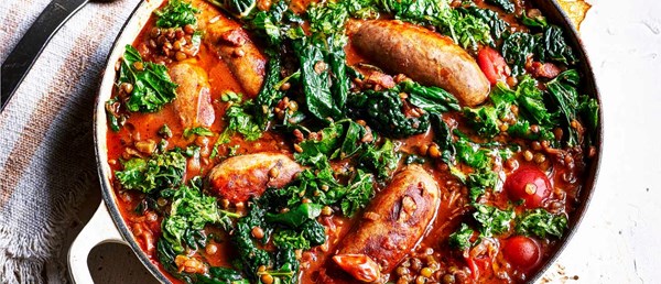 Sausages and braised Puy lentils with kale