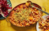 Sausages baked with squash, tomatoes and pasta