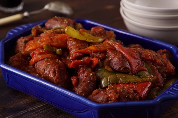 Sausages braised with fresh, roasted, and pickled peppers (Spetzofai)