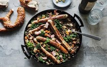 Sausages with bacon, lentils and kale