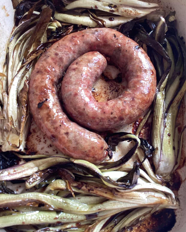 Sausages with braised chicory