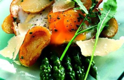 Sauté of Jersey Royals with fried duck egg and griddled asparagus and Parmesan salad