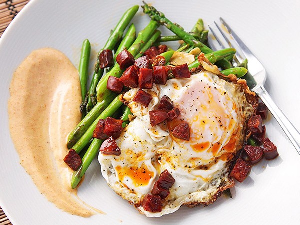 Sautéed asparagus with chorizo, fried eggs, and smoked paprika allioli