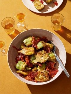Sautéed baby artichokes with fried jamón