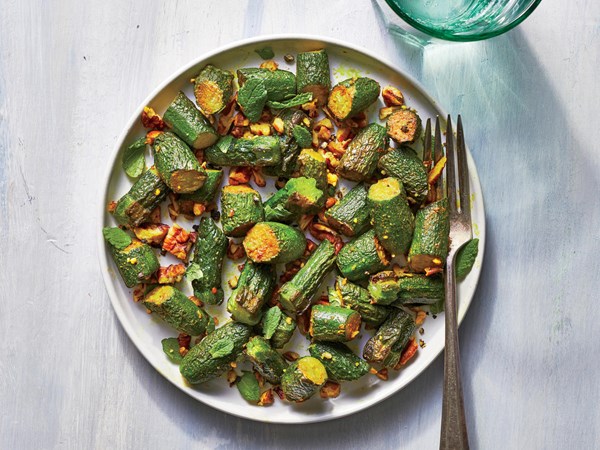 Sautéed baby zucchini with pecans and mint