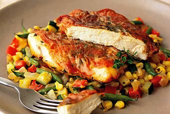 Sautéed chicken breasts with country ham and summer succotash