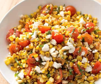 Sautéed corn with cherry tomatoes, ricotta salata, and basil
