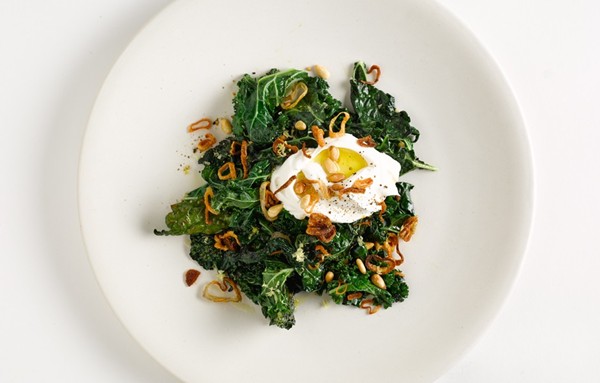 Sautéed greens with labneh and pine nuts