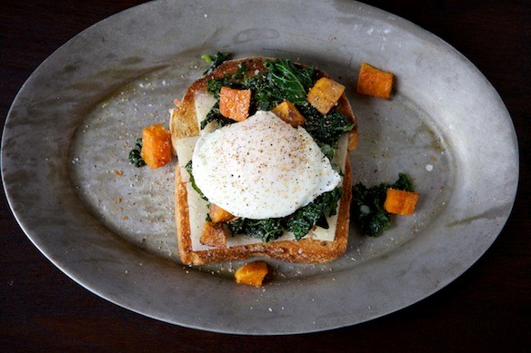 Sautéed kale, roasted sweet potato and poached egg holiday toast
