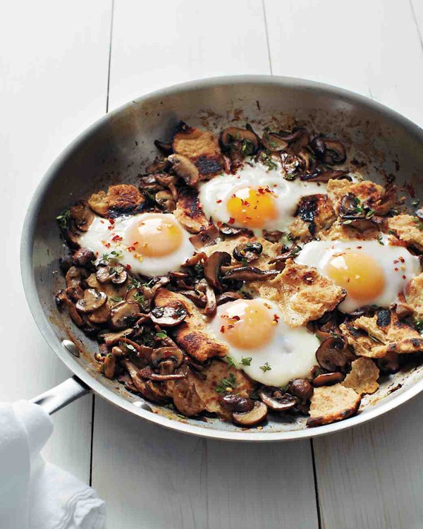 Sautéed mushrooms with toasted flatbread and baked eggs