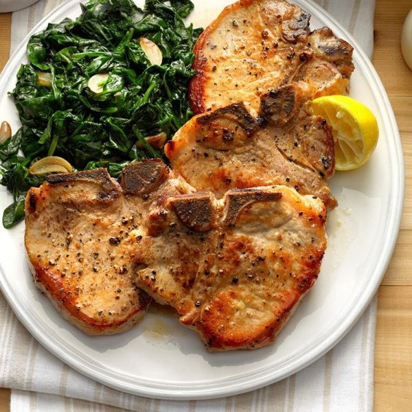 Sauteed pork chops with garlic spinach