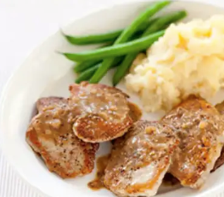 Sautéed pork cutlets with mustard-cider sauce