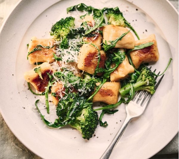 Sautéed potato gnocchi with broccoli, rocket and Parmesan