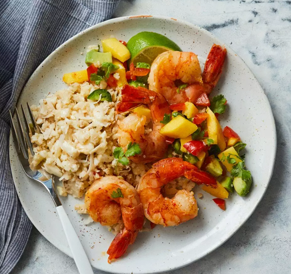 Sautéed shrimp with mango salsa & coconut cauliflower rice
