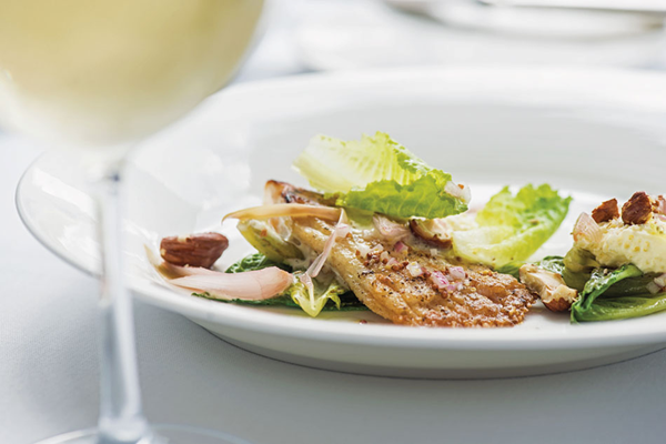 Sautéed skate wing with little gem lettuce, pickled ramps, butter pudding & hazelnuts