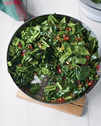 Sautéed spring greens with bacon and mustard seeds