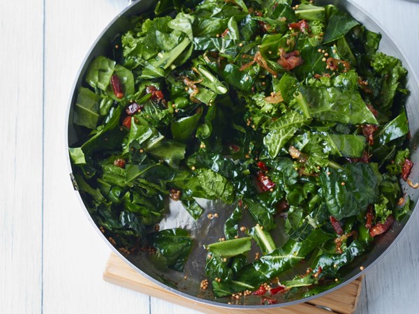Sautéed spring greens with bacon and mustard seeds [Grace Parisi]