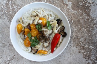 Sauteed spring mushrooms, chiles & cilantro in caramelized coconut broth
