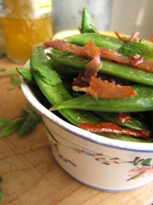 Sautéed sugar snaps with salami crisps