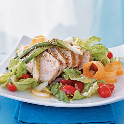 Sautéed tuna and green onion stalks on romaine