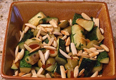 Sauteed zucchini with almonds and olives