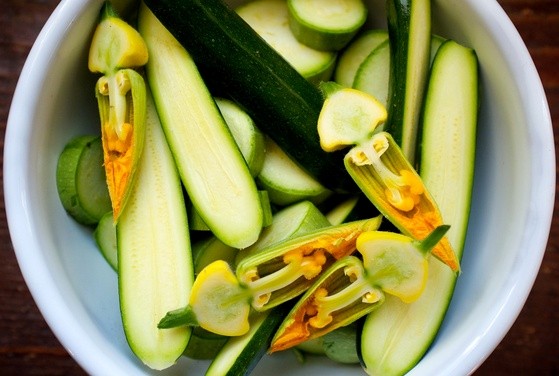 Sautéed zucchini with basil leaves