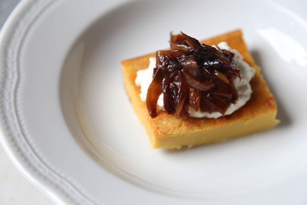 Savory chickpea crepe with fresh ricotta and caramelized onions