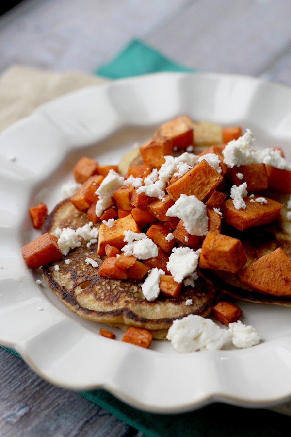 Savory chickpea pancakes with spicy roasted carrots, sweet potatoes, and feta