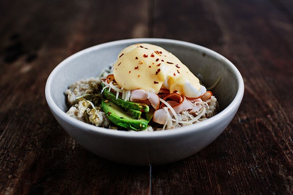 Savory oatmeal with ham, poached eggs, and Hollandaise sauce
