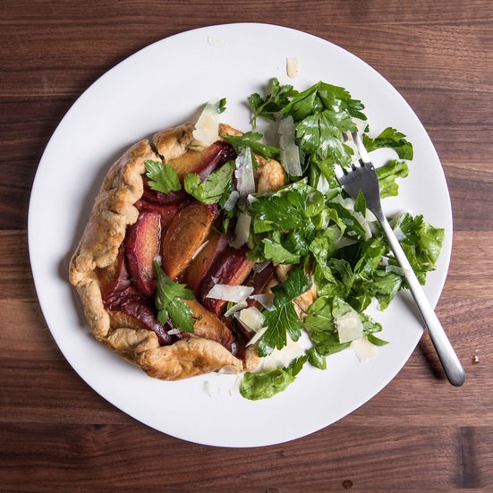 Savory plum tarts with arugula salad