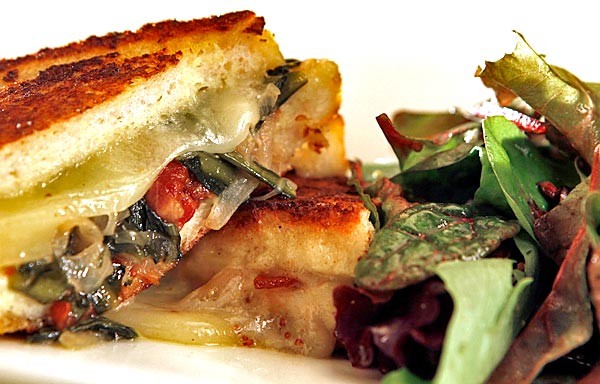 Savory stuffed French toast with bacon, dandelion greens and Gruyère