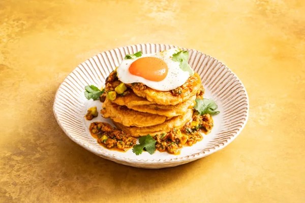 Savoury sweetcorn pancakes with chorizo salsa and fried eggs