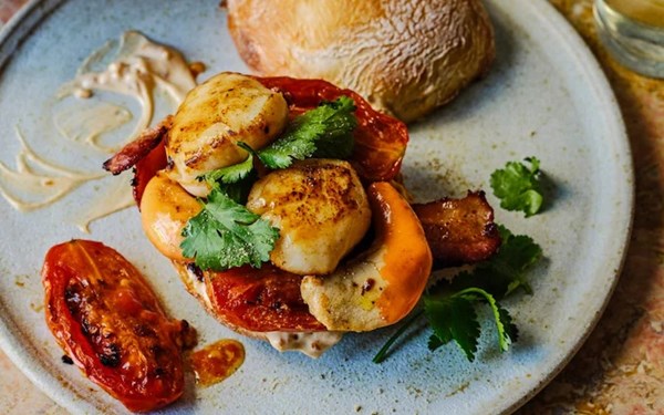 Scallop, bacon and roast tomato roll with smoked paprika mayo