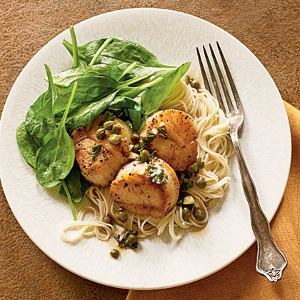 Scallop piccata with sautéed spinach