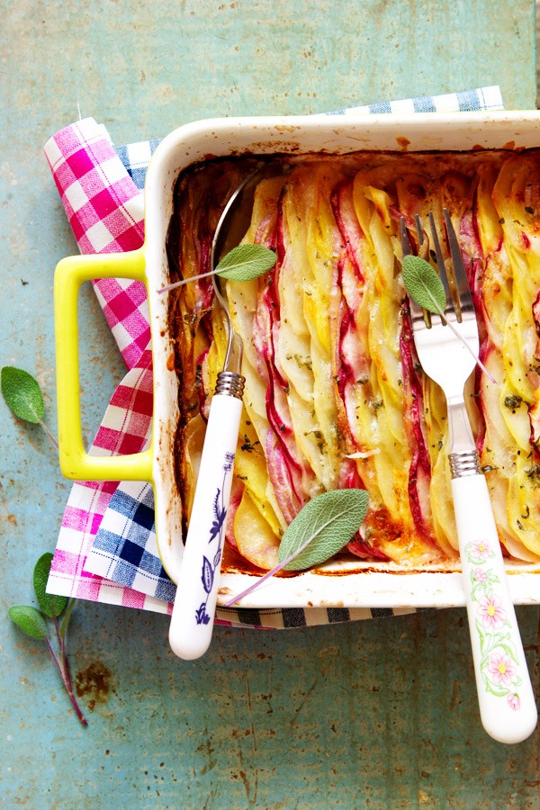 Scalloped potatoes and turnips au gratin with onion and sage