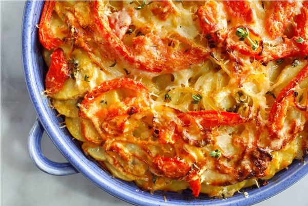Scalloped potatoes with onions, tomatoes, anchovies, herbs, and garlic (Gratin de pommes de terre Provençal)