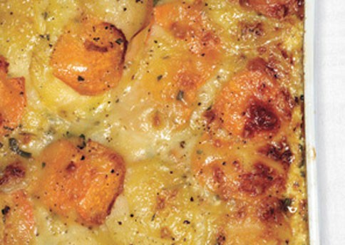 Scalloped Yukon Gold and sweet potato gratin with fresh herbs