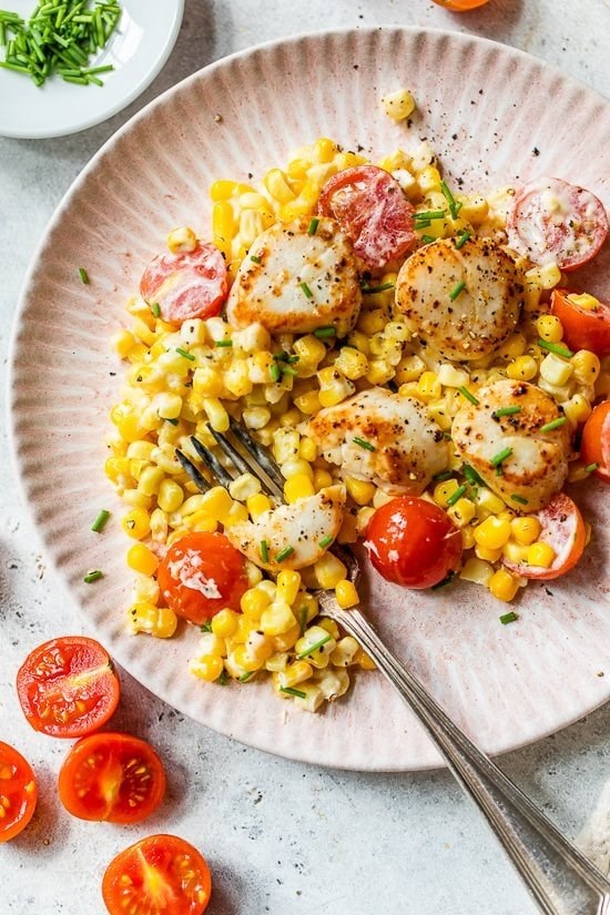 Scallops with creamy corn, tomatoes and chives