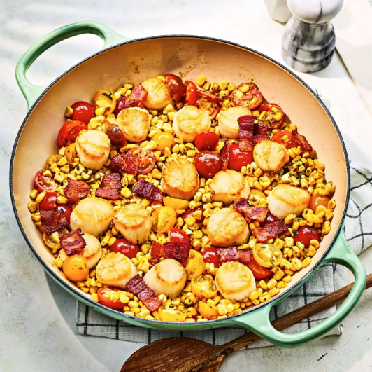 Scallops with pesto, corn, and tomatoes