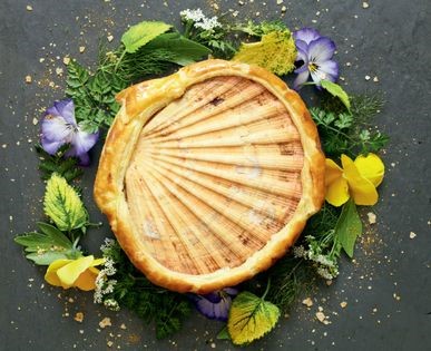 Scallops with ratatouille (Baked hand-dived scallop in the shell with ratatouille and garden herbs)