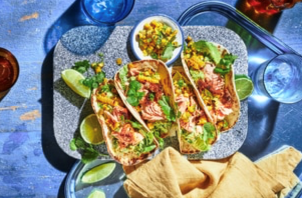 Scorched chipotle salmon tacos with jalapeno and corn salsa