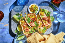 Scorched chipotle salmon tacos with jalapeno and corn salsa
