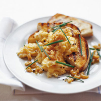 Scrambled eggs with potted shrimps on toast