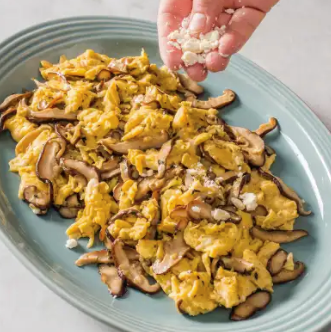 Scrambled eggs with shiitake mushrooms and feta cheese