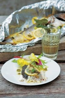 Sea bass baked in a parcel with lemon and herbs