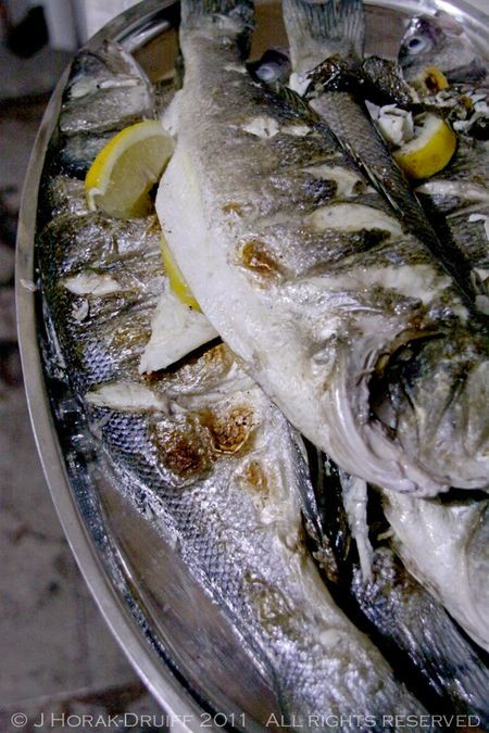 Sea bass grilled whole on the barbecue