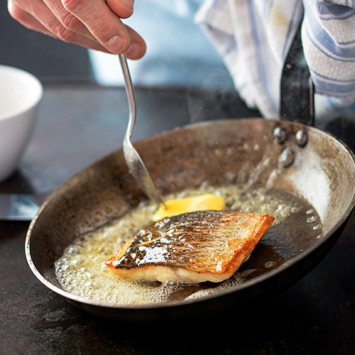 Sea bass with black grape sauce & celery