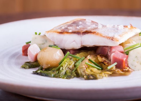 Sea bass with herb gnocchi, confit onions and horseradish sauce