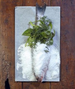 Sea bass with herbs in salt crust