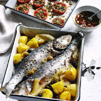 Sea bass with lemon, olives, tomatoes and saffron potatoes